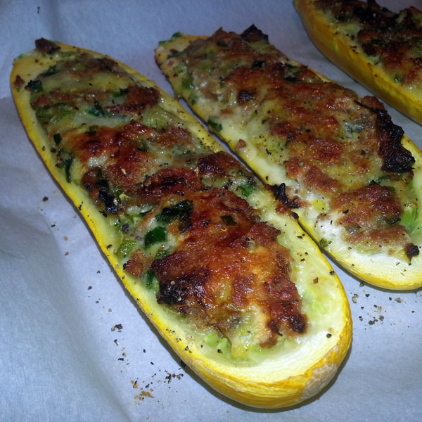 Stuffed zucchini with rye toast points, goat cheese and spring onions